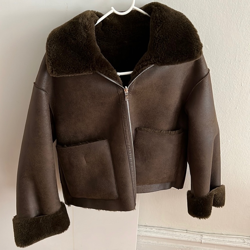 chocolate brown faux fur lined jacket with suede exterior.